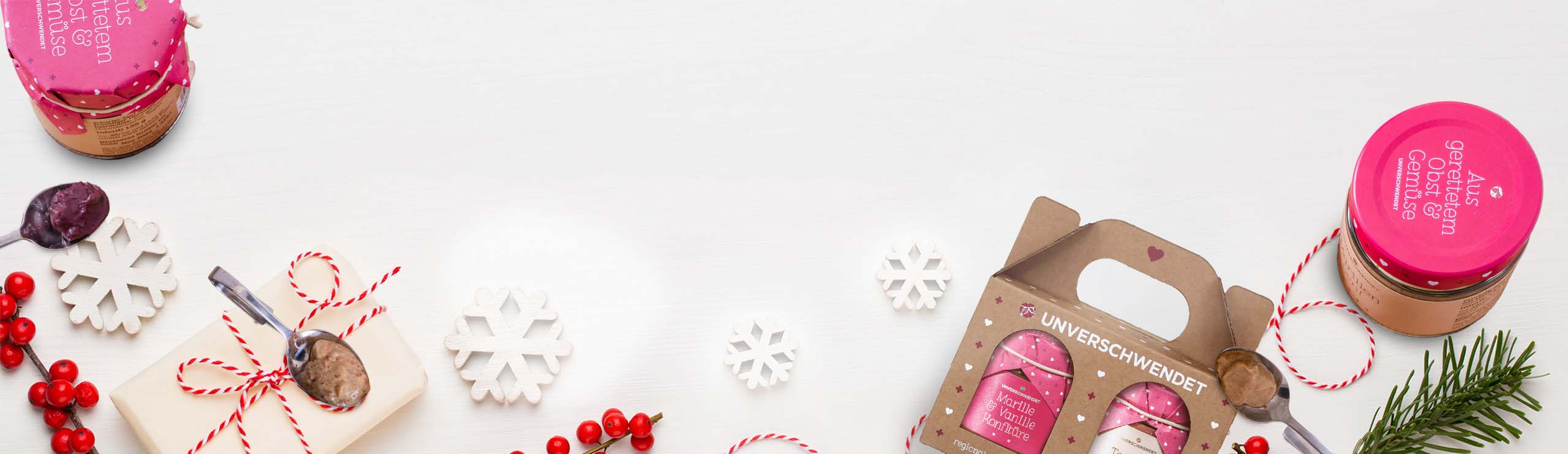 Geschenkideen zu Weihnachten: Nachhaltig und Köstlich von Unverschwendet Unverschwendet Produkte auf weihnachtlichem Hintergrund